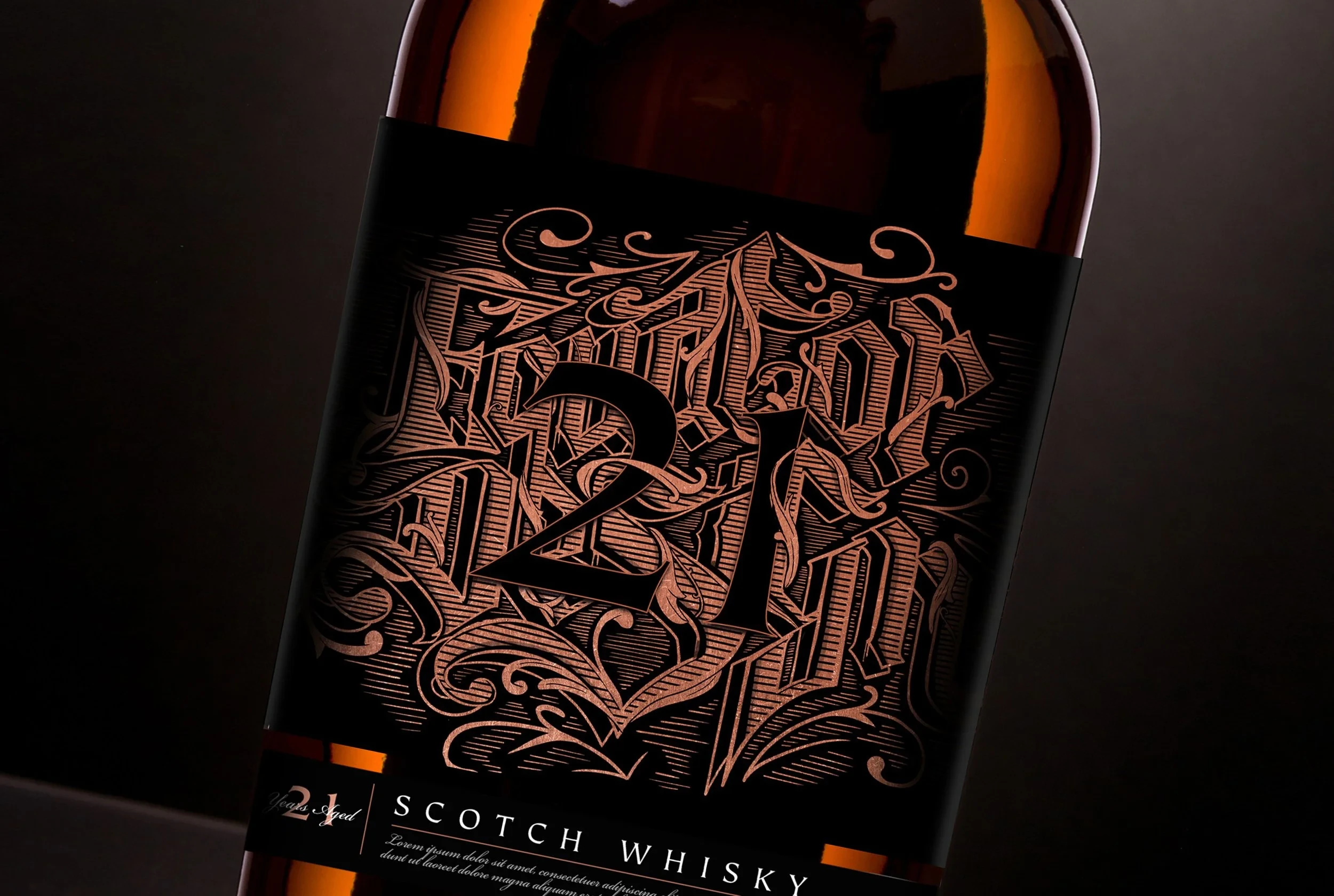Hand-lettered copper foil label detail for a 21 year aged Scotch whisky