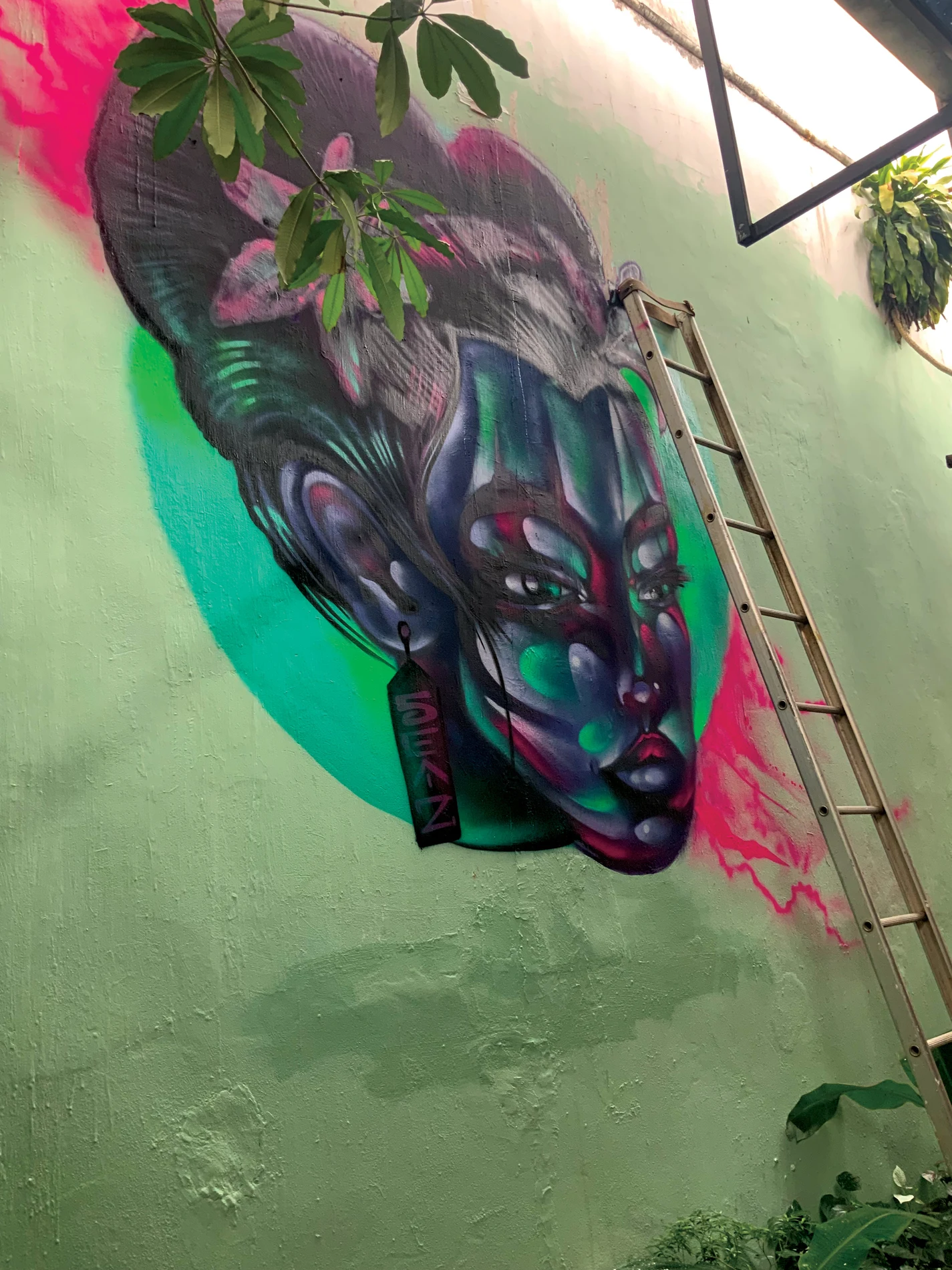 Neon-toned portrait mural in Siem Reap, Cambodia