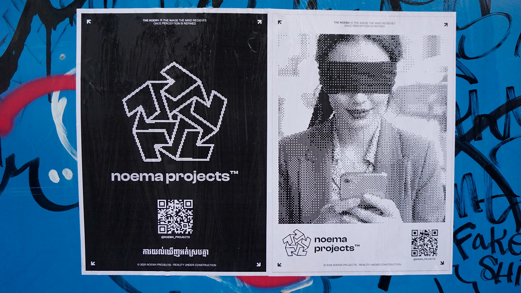 Noema Projects posters pasted on a street wall in Phnom Penh